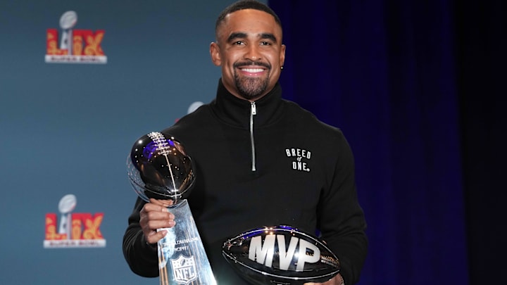 Feb 10, 2025; New Orleans, LA, USA; Philadelphia Eagles quarterback Jalen Hurts (1) poses with the Vince Lombardi trophy at the Super Bowl LIX Winning Head Coach and Most Valuable Player press conference at the Ernest N. Morial Convention Center. Mandatory Credit: Kirby Lee-Imagn Images