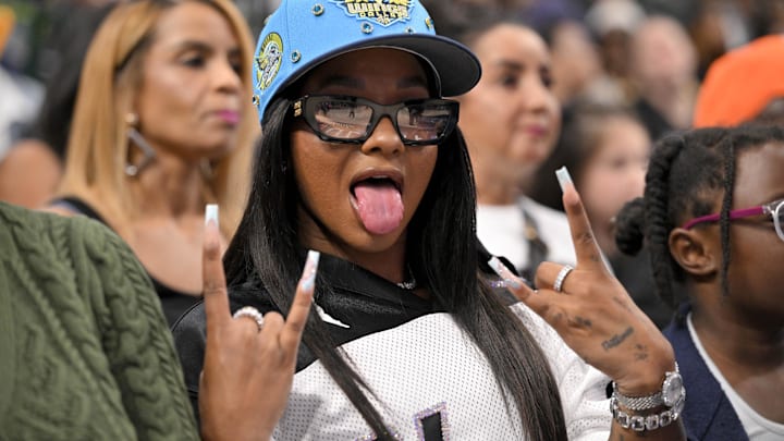 Olympic gymnast Jordan Chiles poses for a photo during the second half of the game between the Dallas Wings and the Indiana Fever at the American Airlines Center.