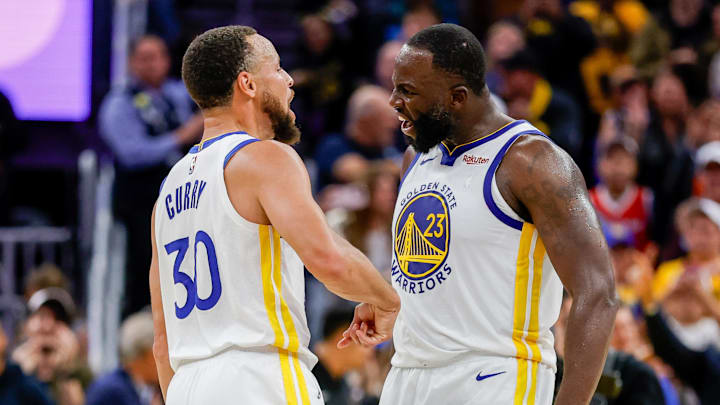 Oct 23, 2025; San Francisco, California, USA; Golden State Warriors guard Stephen Curry (30) and Golden State Warriors forward Draymond Green (23) celebrate during overtime against the Denver Nuggets at Chase Center. Mandatory Credit: Bob Kupbens-Imagn Images