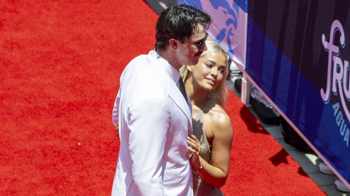 Jul 16, 2024; Arlington, Texas, USA; National League pitcher Paul Skenes of the Pittsburgh Pirates walks the red carpet with his girlfriend LSU gymnast Olivia Livvy Dunne before the 2024 MLB All-Star game at Globe Life Field.