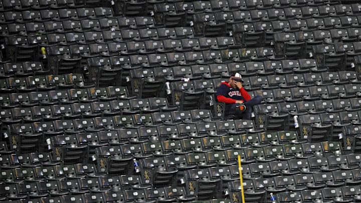 Oct 19, 2024; Cleveland, Ohio, USA; A Cleveland Guardians fan reacts in the stands after the New York Yankees beat the Cleveland Guardians during game five of the ALCS for the 2024 MLB playoffs at Progressive Field. Mandatory Credit: David Richard-Imagn Images Oct 19, 2024; Cleveland, Ohio, USA; A Cleveland Guardians fan reacts in the stands after the New York Yankees beat the Cleveland Guardians during game five of the ALCS for the 2024 MLB playoffs at Progressive Field. Mandatory Credit: David Richard-Imagn Images