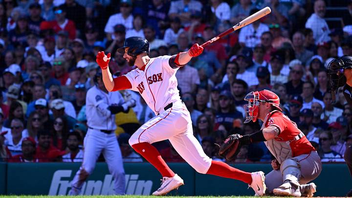 Sep 7, 2026; Boston, Massachusetts, USA; Boston Red Sox center fielder Eli White (38) hits a one run RBI single against the Los Angeles Angels during the third inning at Fenway Park. Mandatory Credit: Eric Canha-Imagn Images