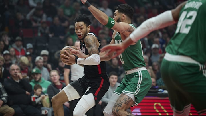 Mar 23, 2025; Portland, Oregon, USA: Portland Trail Blazers guard Anfernee Simons (1) dribbles the ball during the first half against Boston Celtics forward Jayson Tatum (0) at Moda Center. Mandatory Credit: Troy Wayrynen-Imagn Images Mar 23, 2025; Portland, Oregon, USA: Portland Trail Blazers guard Anfernee Simons (1) dribbles the ball during the first half against Boston Celtics forward Jayson Tatum (0) at Moda Center. Mandatory Credit: Troy Wayrynen-Imagn Images