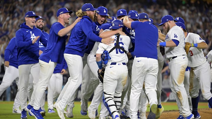 Oct 20, 2024; Los Angeles, California, USA; Los Angeles Dodgers pitcher Blake Treinen (49) players celebrate after defeating the New York Mets in game six of the NLCS for the 2024 MLB playoffs at Dodger Stadium. Mandatory Credit: Jayne Kamin-Oncea-Imagn Images