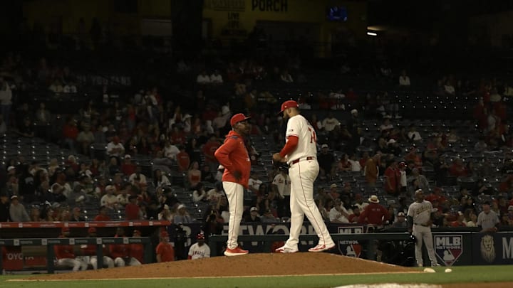 Angels manager Ron Washington (37) brings in relief pitcher Kenley Jansen (74) to close out the ninth inning against the Athletics at Angel Stadium on June 9.