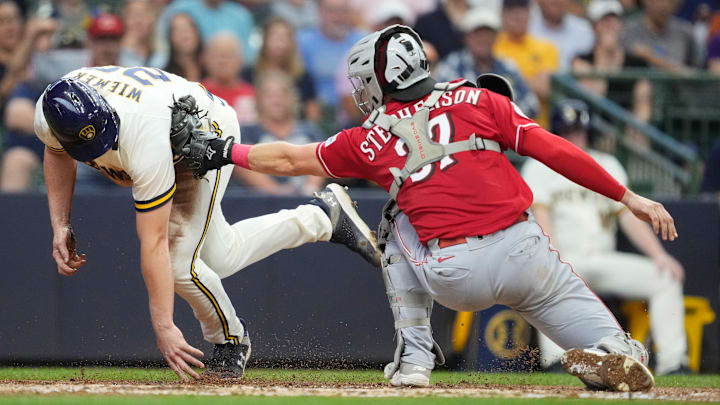 Cincinnati Reds catcher Tyler Stephenson tags out Milwaukee Brewers outfielder Joey Wiemer