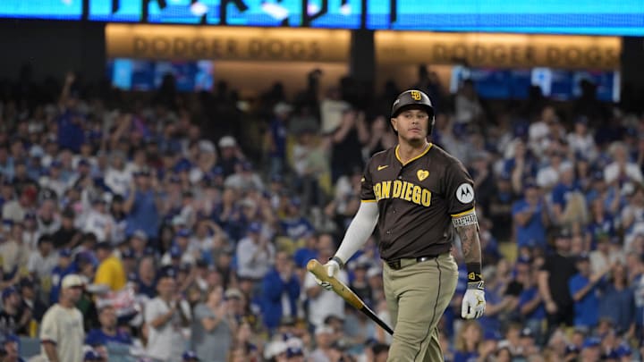 Los Angeles, California, USA; San Diego Padres third baseman Manny Machado (13) reacts after striking out in the sixth inning against the Los Angeles Dodgers during Game 2 of the NLDS for the 2024 MLB Playoffs at Dodger Stadium.