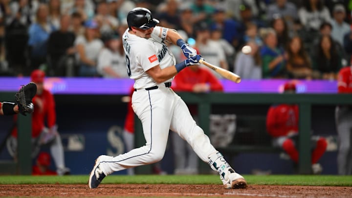 Sep 13, 2025; Seattle, Washington, USA; Seattle Mariners catcher Cal Raleigh (29) hits a single against the Los Angeles Angels during the fifth inning at T-Mobile Park. Mandatory Credit: Steven Bisig-Imagn Images