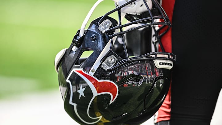 Sep 22, 2024; Minneapolis, Minnesota, USA; A Houston Texans player holds onto his helmet from the sideline during the game against the Minnesota Vikings at U.S. Bank Stadium. Mandatory Credit: Jeffrey Becker-Imagn Images Sep 22, 2024; Minneapolis, Minnesota, USA; A Houston Texans player holds onto his helmet from the sideline during the game against the Minnesota Vikings at U.S. Bank Stadium. Mandatory Credit: Jeffrey Becker-Imagn Images