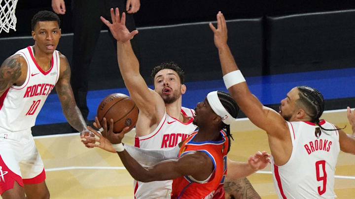 Dec 14, 2024; Las Vegas, Nevada, USA; Oklahoma City Thunder guard Shai Gilgeous-Alexander (2) shoots against Houston Rockets center Alperen Sengun (28) during the first quarter in a semifinal of the 2024 Emirates NBA Cup at T-Mobile Arena. Mandatory Credit: Kyle Terada-Imagn Images Dec 14, 2024; Las Vegas, Nevada, USA; Oklahoma City Thunder guard Shai Gilgeous-Alexander (2) shoots against Houston Rockets center Alperen Sengun (28) during the first quarter in a semifinal of the 2024 Emirates NBA Cup at T-Mobile Arena. Mandatory Credit: Kyle Terada-Imagn Images