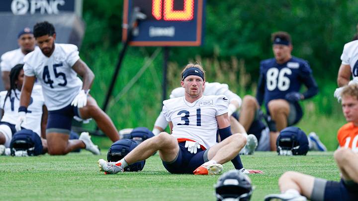 Bears rookie safety Dillon Thieneman stretches during minicamp at Halas Hall. Bears rookie safety Dillon Thieneman stretches during minicamp at Halas Hall.