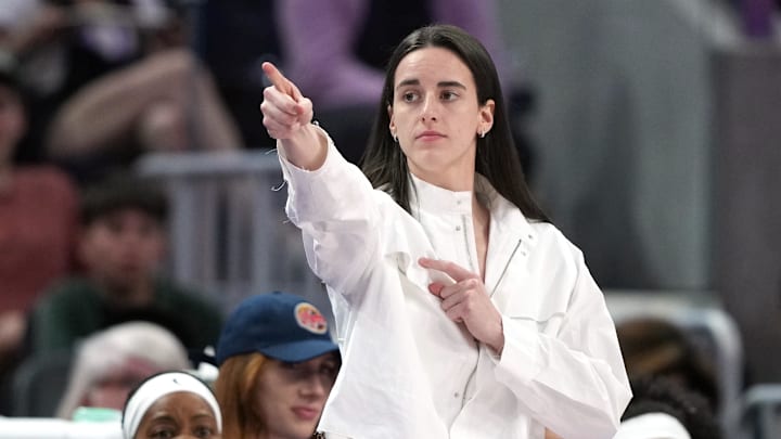 Aug 31, 2025; San Francisco, California, USA; Indiana Fever guard Caitlin Clark (center) gestures after an offensive foul by Golden State Valkyries guard Veronica Burton (foreground right) during the third quarter at Chase Center. Mandatory Credit: Darren Yamashita-Imagn Images