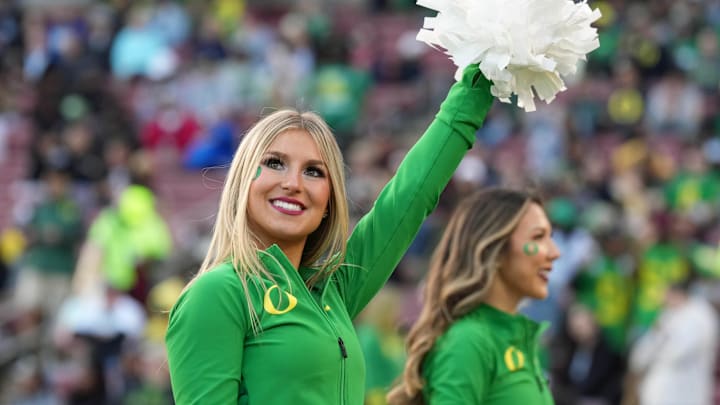 Sep 30, 2023; Stanford, California, USA; An Oregon Ducks cheerleader performs during the third quarter against the Stanford Cardinal at Stanford Stadium. Mandatory Credit: Darren Yamashita-Imagn Images