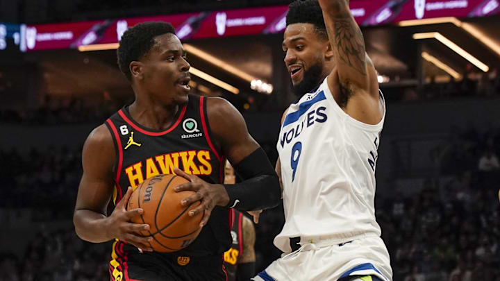 Atlanta Hawks guard Aaron Holiday (3) drives to the basket as ex-Minnesota Timberwolves guard Nickeil Alexander-Walker (9) defends in the first quarter at Target Center.