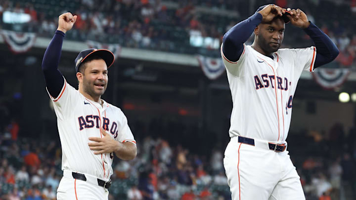 Oct 1, 2024; Houston, Texas, USA; Houston Astros second baseman Jose Altuve (27) and Houston Astros outfielder Yordan Alvarez (44) warm up before playing against the Detroit Tigers in game one of the Wild Card round for the 2024 MLB Playoffs at Minute Maid Park.