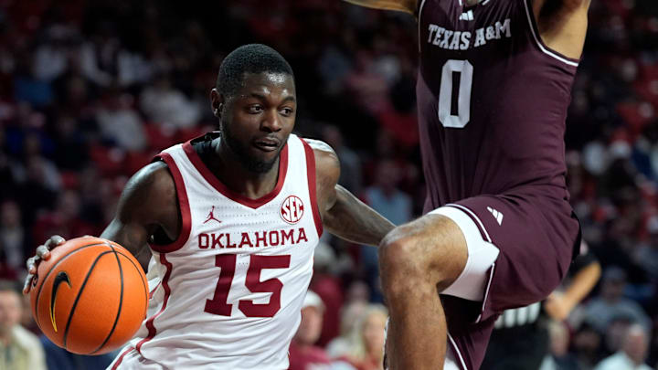 Oklahoma Sooners guard Duke Miles (15) moves past Texas A&M Aggies guard Jace Carter (0) during an SEC men's college basketball game between the University of Oklahoma Sooners (OU) and the Texas A&M Aggies at Lloyd Noble Center in Norman, Okla., Wednesday, Jan. 8, 2025. Texas A&M won 80-78.