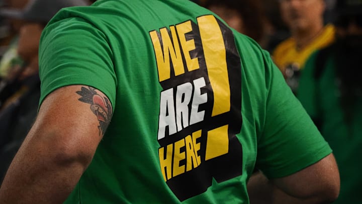 Apr 28, 2023; Oakland, California, USA; An Oakland Athletics fan s shirt reads we are here! during the sixth inning against the Cincinnati Reds at Oakland Coliseum. Mandatory Credit: Kelley L Cox-Imagn Images Apr 28, 2023; Oakland, California, USA; An Oakland Athletics fan s shirt reads we are here! during the sixth inning against the Cincinnati Reds at Oakland Coliseum. Mandatory Credit: Kelley L Cox-Imagn Images