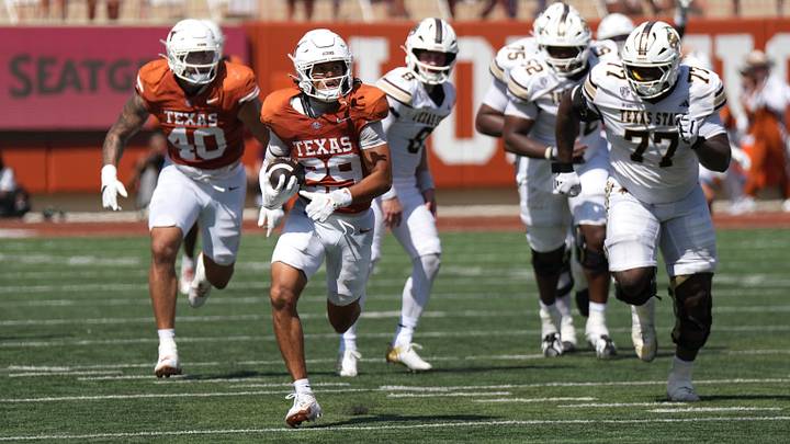 Texas Longhorns defensive back Graceson Littleton runs for a touchdown after recovering a fumble against the Texas State Bobcats. Texas Longhorns defensive back Graceson Littleton runs for a touchdown after recovering a fumble against the Texas State Bobcats.