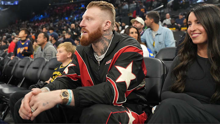 Las Vegas Raiders defensive end Maxx Crosby and wife Rachel Washburn attend an NBA game.