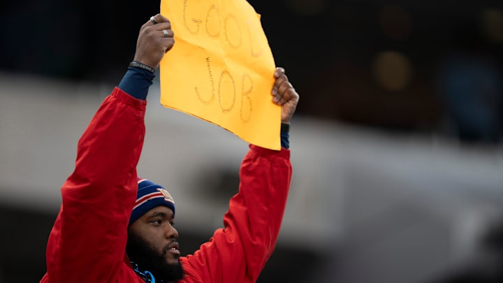 A New York Giants fan holds up a sign saying, “Good job,” during a game between the Giants and the Indianapolis Colts at MetLife Stadium on Sunday, Dec. 29, 2024.