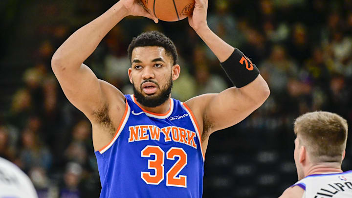 Mar 11, 2026; Salt Lake City, Utah, USA; New York Knicks center/forward Karl-Anthony Towns (32) looks to pass over Utah Jazz center Kyle Filipowski (22) during the first half at Delta Center. Mandatory Credit: Peter Creveling-Imagn Images