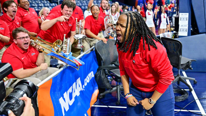 Mar 23, 2024; South Bend, Indiana, USA; Ole Miss Rebels head coach Yolett McPhee-McCuin celebrates with the Ole Miss band after defeating the Marquette Golden Eagles 67-55 in the first round of the NCAA Tournament at the Purcell Pavilion. Mandatory Credit: Matt Cashore-Imagn Images
