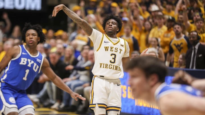 Feb 28, 2026; Morgantown, West Virginia, USA; West Virginia Mountaineers guard Honor Huff (3) shoots a three point shot over BYU Cougars guard Robert Wright III (1) during the second half at Hope Coliseum. Mandatory Credit: Ben Queen-Imagn Images Feb 28, 2026; Morgantown, West Virginia, USA; West Virginia Mountaineers guard Honor Huff (3) shoots a three point shot over BYU Cougars guard Robert Wright III (1) during the second half at Hope Coliseum. Mandatory Credit: Ben Queen-Imagn Images