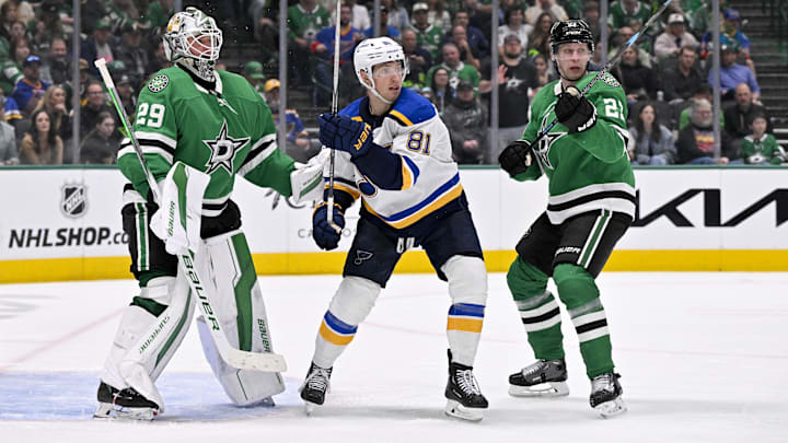 Mar 2, 2025; Dallas, Texas, USA; Dallas Stars goaltender Jake Oettinger (29) and defenseman Esa Lindell (23) and St. Louis Blues left wing Dylan Holloway (81) in action during the game between the Dallas Stars and the St. Louis Blues at the American Airlines Center. Mandatory Credit: Jerome Miron-Imagn Images
