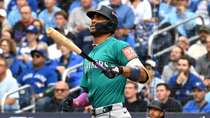 Oct 13, 2025; Toronto, Ontario, CAN; Seattle Mariners center fielder Julio Rodriguez (44) hits a three run home run against the Toronto Blue Jays in the first inning during game two of the ALCS round for the 2025 MLB playoffs at Rogers Centre. Mandatory Credit: Dan Hamilton-Imagn Images