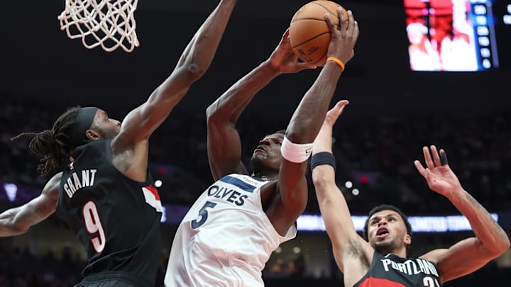 Oct 22, 2025; Portland, Oregon, USA; Minnesota Timberwolves guard Anthony Edwards (5) shoots the ball over Portland Trail Blazers forward Jerami Grant (9) and Trail Blazers’ forward Toumani Camara (33) in the first half at Moda Center. Oct 22, 2025; Portland, Oregon, USA; Minnesota Timberwolves guard Anthony Edwards (5) shoots the ball over Portland Trail Blazers forward Jerami Grant (9) and Trail Blazers’ forward Toumani Camara (33) in the first half at Moda Center.