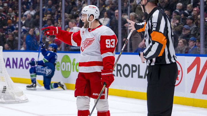 Feb 2, 2025; Vancouver, British Columbia, CAN; Detroit Red Wings forward Alex DeBrincat (93) celebrates his overtime goal against the Vancouver Canucks at Rogers Arena. Mandatory Credit: Bob Frid-Imagn Images