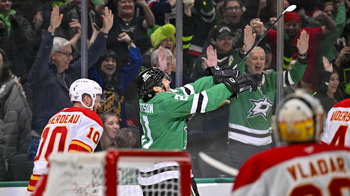 Mar 6, 2025; Dallas, Texas, USA; Dallas Stars left wing Jason Robertson (21) celebrates after he scores the game winning goal against Calgary Flames goaltender Dan Vladar (80) during the overtime period at the American Airlines Center. Mandatory Credit: Jerome Miron-Imagn Images