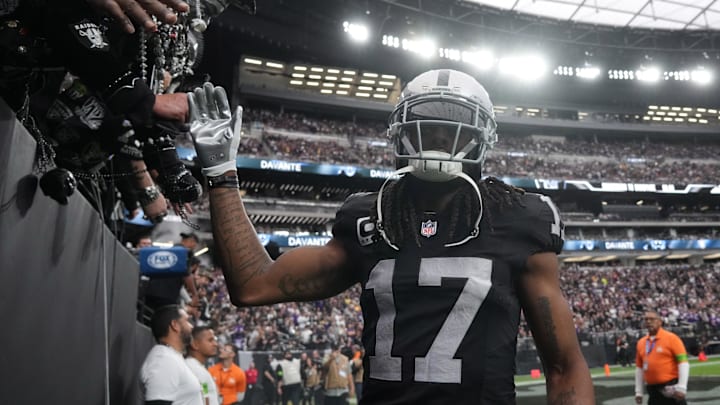 Dec 10, 2023; Paradise, Nevada, USA; Las Vegas Raiders wide receiver Davante Adams (17) is greeted by fans during teh game against the Minnesota Vikings at Allegiant Stadium. Mandatory Credit: Kirby Lee-Imagn Images