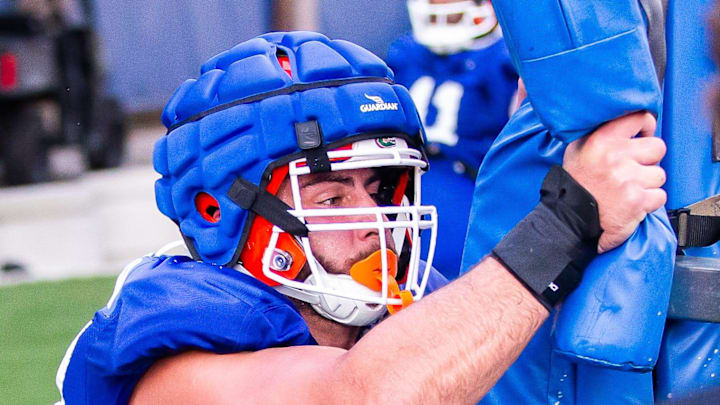 Florida Gators defensive lineman Joey Slackman (97) hits the sled during Fall practice at Sanders Practice Fields in Gainesville, FL on Tuesday, August 6, 2024. [Doug Engle/Gainesville Sun]