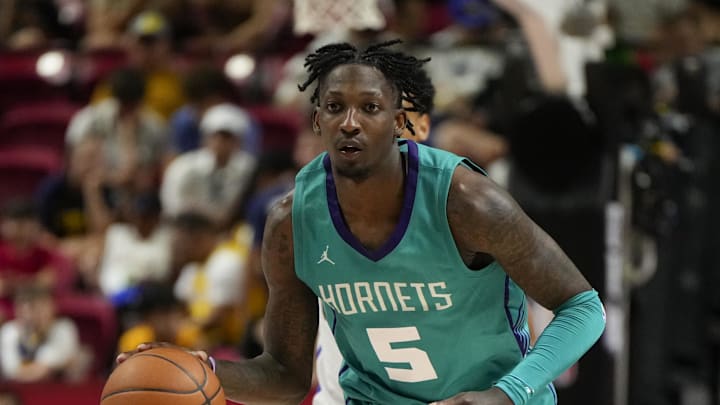 Jul 14, 2025; Las Vegas, NV, USA; Charlotte Hornets guard Damion Baugh (5) dribbles the ball against the Dallas Mavericks during the second half of a NBA basketball game at the Thomas & Mack Center. Mandatory Credit: Lucas Peltier-Imagn Images