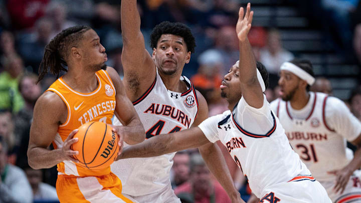Tennessee guard Chaz Lanier (2) is guarded by Auburn guard Joah Shay (12) and center Dylan Cardwell (44) during the first half of their semifinal game of the SEC Men's Basketball Tournament at Bridgestone Arena in Nashville, Tenn., Saturday, March 15, 2025.