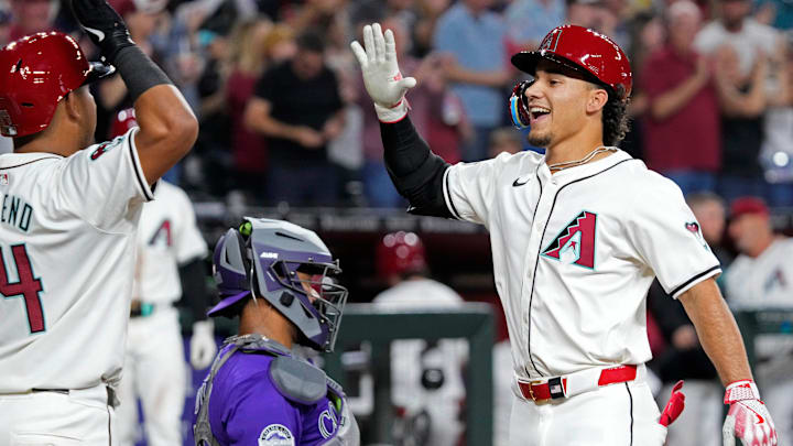 Diamondbacks Alek Thomas (5) celebrates a home run with teammate Gabriel Moreno against the Rockies during a game at Chase Field in Phoenix on March 29, 2024. Diamondbacks Alek Thomas (5) celebrates a home run with teammate Gabriel Moreno against the Rockies during a game at Chase Field in Phoenix on March 29, 2024.