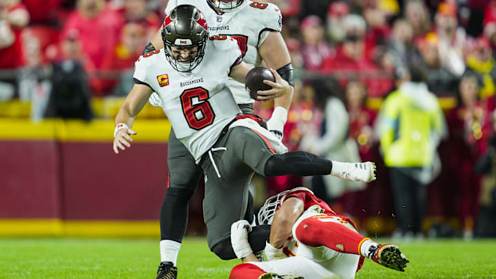 Nov 4, 2024; Kansas City, Missouri, USA; Tampa Bay Buccaneers quarterback Baker Mayfield (6) is tackled by Kansas City Chiefs defensive end George Karlaftis (56) during the first half at GEHA Field at Arrowhead Stadium. Mandatory Credit: Jay Biggerstaff-Imagn Images Nov 4, 2024; Kansas City, Missouri, USA; Tampa Bay Buccaneers quarterback Baker Mayfield (6) is tackled by Kansas City Chiefs defensive end George Karlaftis (56) during the first half at GEHA Field at Arrowhead Stadium. Mandatory Credit: Jay Biggerstaff-Imagn Images