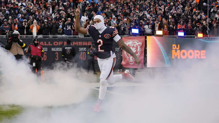 Jan 4, 2026; Chicago, Illinois, USA; Chicago Bears wide receiver DJ Moore (2) runs onto the field before the game between the Chicago Bears and the Detroit Lions at Soldier Field. Mandatory Credit: David Banks-Imagn Images
