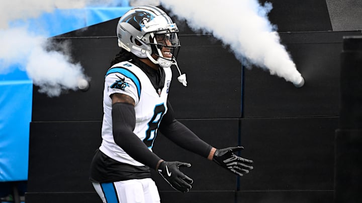 Dec 15, 2024; Charlotte, North Carolina, USA;  Carolina Panthers cornerback Jaycee Horn (8) runs on to the field before the game at Bank of America Stadium. Mandatory Credit: Bob Donnan-Imagn Images