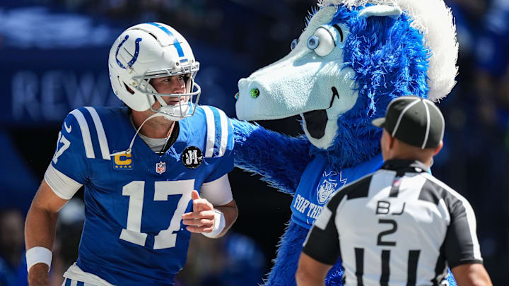 Indianapolis Colts quarterback Daniel Jones (17) celebrates a touchdown with Blue on Sunday, Sept. 7, 2025, during the game at Lucas Oil Stadium in Indianapolis. The Indianapolis Colts defeated the Miami Dolphins, 33-8. Indianapolis Colts quarterback Daniel Jones (17) celebrates a touchdown with Blue on Sunday, Sept. 7, 2025, during the game at Lucas Oil Stadium in Indianapolis. The Indianapolis Colts defeated the Miami Dolphins, 33-8.