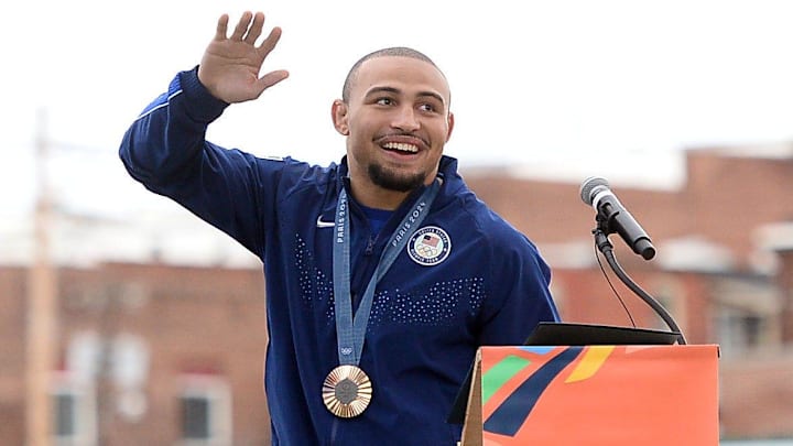 Olympic medalist Aaron Brooks waves to the crowd during a community celebration at Hagerstown's Meritus Park.