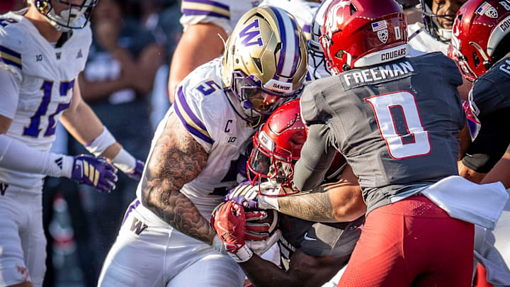 Zach Durfee slams into a Washington State ball carrier. Zach Durfee slams into a Washington State ball carrier.