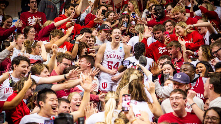 Indiana's Mackenzie Holmes (54) celebrates in the stands after the NCAA Tournament at Simon Skjodt Assembly Hall.