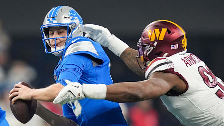 Detroit Lions quarterback Jared Goff (16) looks to avoid Washington Commanders defensive end Dorance Armstrong (92). Detroit Lions quarterback Jared Goff (16) looks to avoid Washington Commanders defensive end Dorance Armstrong (92).