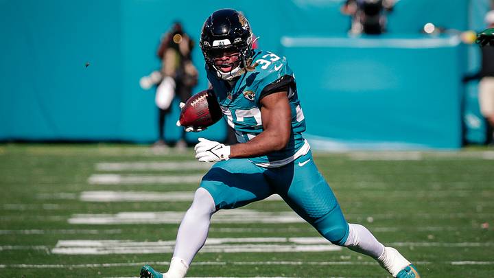 Dec 14, 2025; Jacksonville, Florida, USA;Jacksonville Jaguars running back Bhayshul Tuten (33) runs the ball against the New York Jets at EverBank Stadium. 