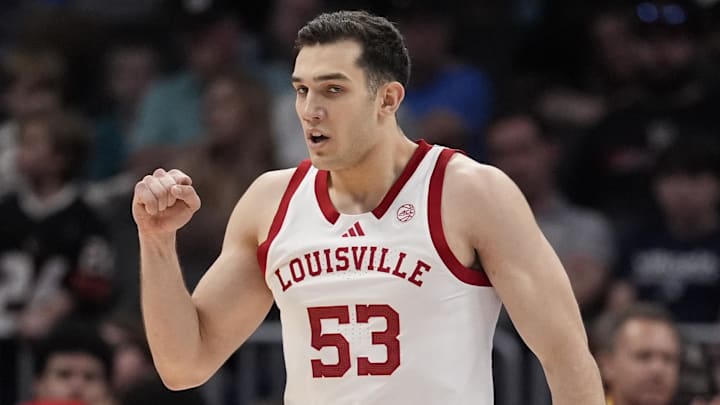 Mar 11, 2026; Charlotte, NC, USA;  Louisville Cardinals forward Vangelis Zougris (53) reacts to a score during the second half against the Southern Methodist University Mustangs at Spectrum Center. Mandatory Credit: Jim Dedmon-Imagn Images