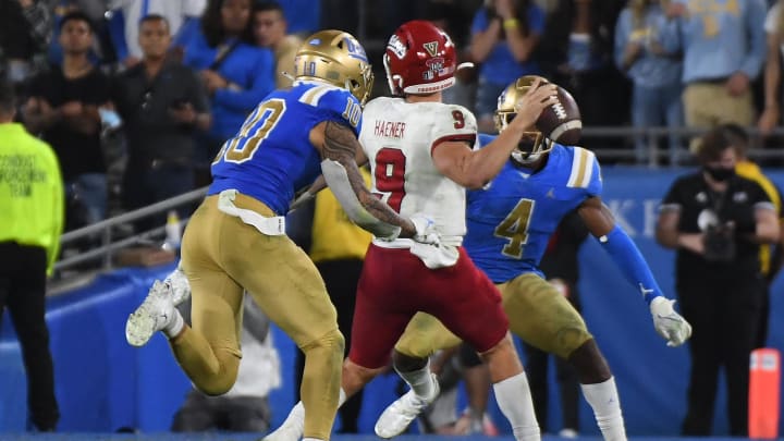 Sep 18, 2021; Pasadena, California, USA;  Fresno State Bulldogs quarterback Jake Haener throws while being defended by Ale Kaho.