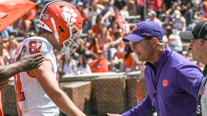 Apr 6, 2024; Clemson, South Carolina, USA; Clemson Tigers kicker Nolan Hauser (81) celebrates with Tigers head coach Dabo Swinney (right) after kicking a field goal during the first quarter of the Clemson spring football game at Memorial Stadium. Mandatory Credit: Ken Ruinard-Imagn Images