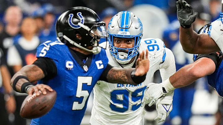 Detroit Lions defensive end Za'Darius Smith (99) pressures Indianapolis Colts quarterback Anthony Richardson (5) during the second half at Lucas Oil Stadium in Indianapolis, Ind. on Sunday, Nov. 24, 2024.